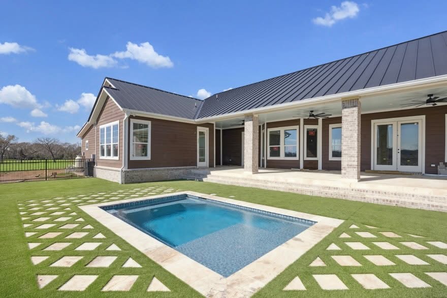 Pool deck and clear water at Spring TX residential property